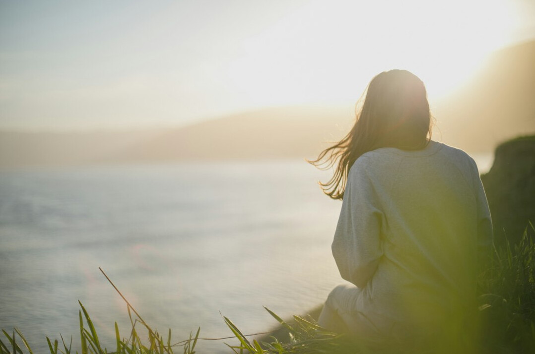 woman looking determined at sunrise