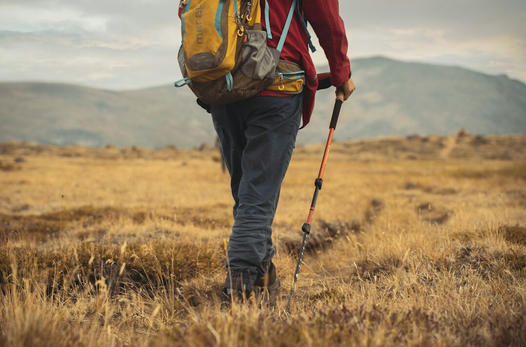 person hiking mountain trail