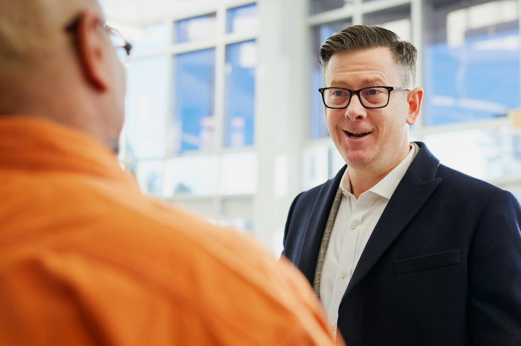 person speaking confidently in meeting