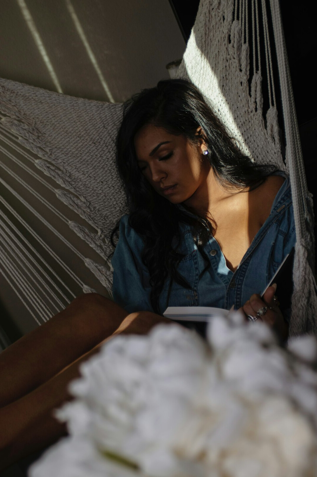 Brazilian woman writing reflections in a journal