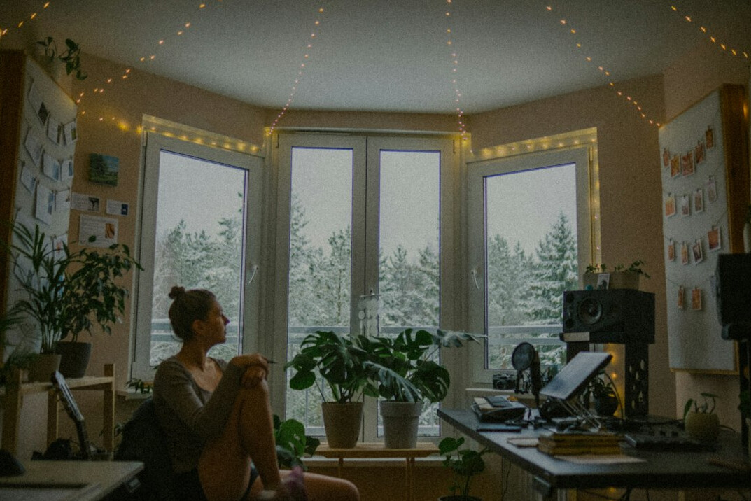person meditating in quiet room