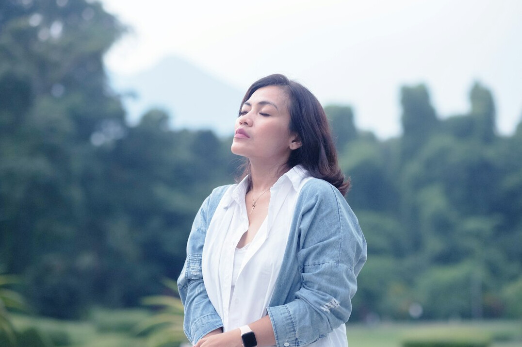 woman doing mindful breathing